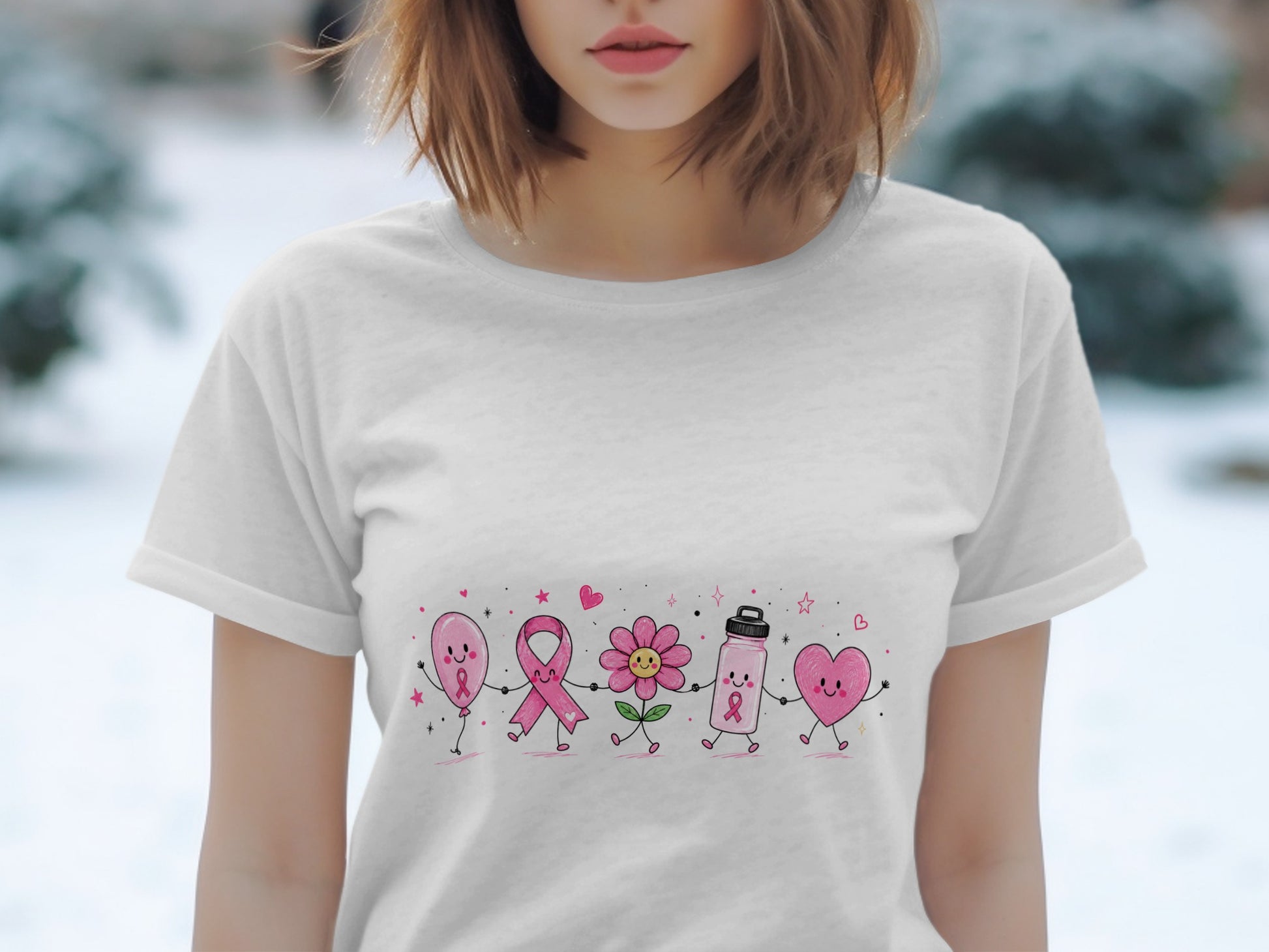 White t-shirt with cartoon pink balloon, ribbon, flower, water bottle, and heart holding hands.