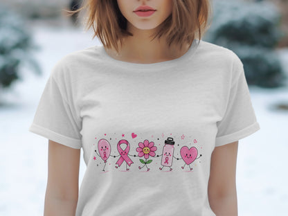 White t-shirt with cartoon pink balloon, ribbon, flower, water bottle, and heart holding hands.
