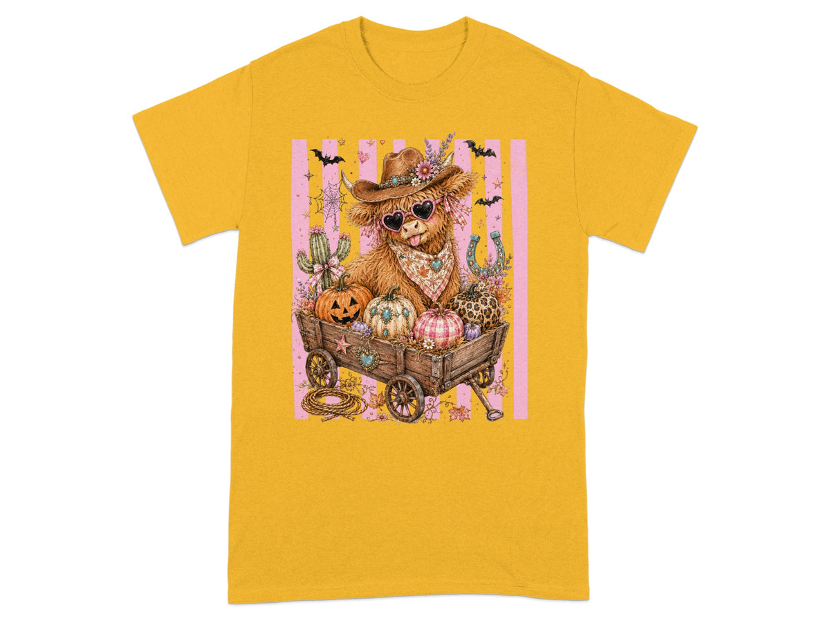 Highland cow in cowboy hat and heart sunglasses with pumpkins in a wagon.