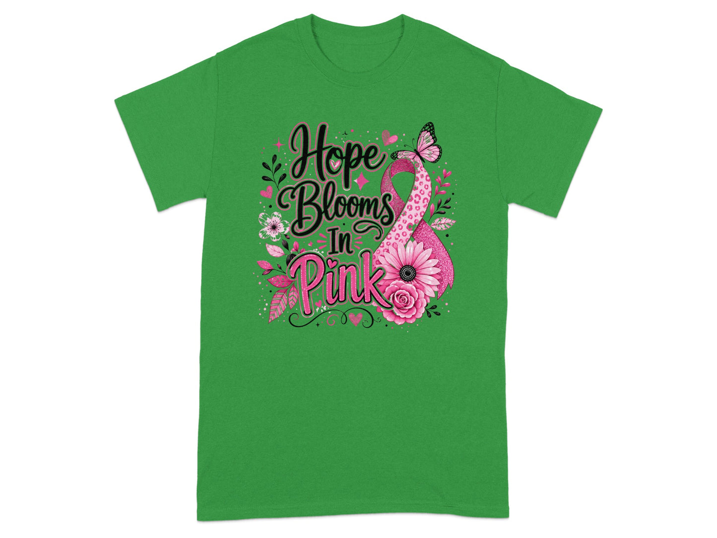 Green t-shirt with text "Hope Blooms In Pink" and a pink ribbon.