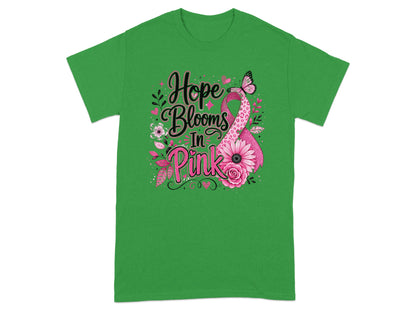 Green t-shirt with text "Hope Blooms In Pink" and a pink ribbon.