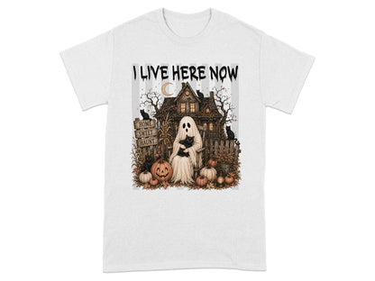 Ghost in a chair holding black cat with haunted house, pumpkins, and text "I LIVE HERE NOW".