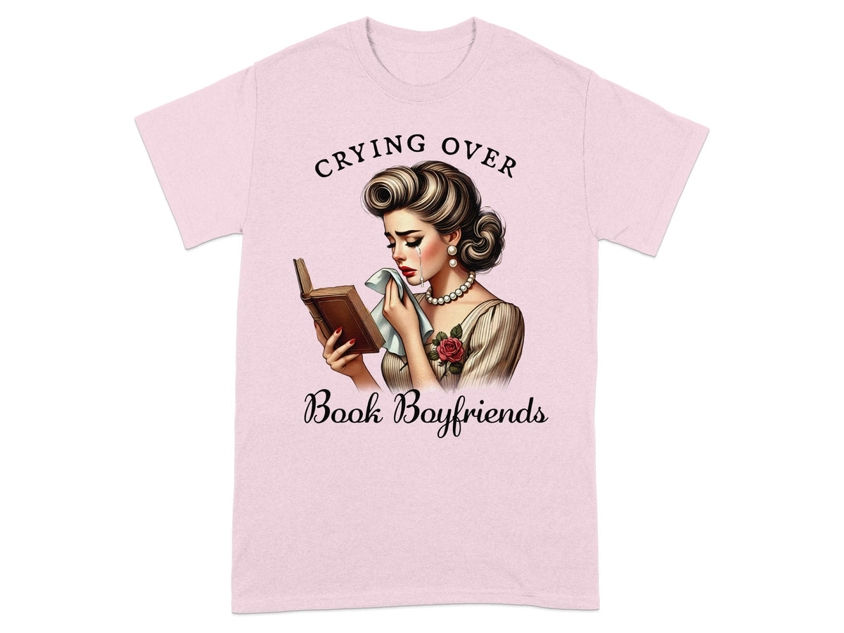 Pink t-shirt graphic of a woman crying over a book, reading "Crying Over Book Boyfriends".