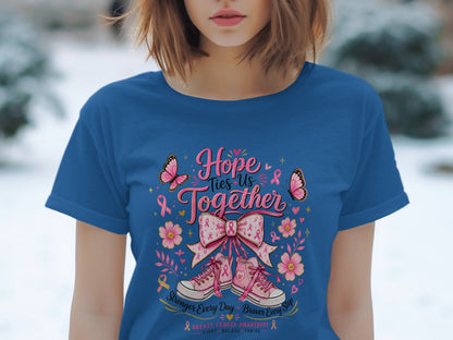 Blue t-shirt with "Hope Ties Us Together" text, pink ribbon, butterflies, flowers, and sneakers.