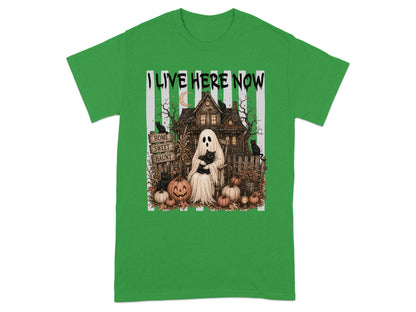 Green t-shirt with "I LIVE HERE NOW" and a haunted house scene.