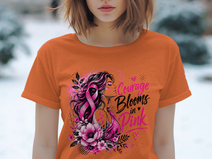 Orange t-shirt with pink ribbon graphic and text "Courage Blooms in Pink".