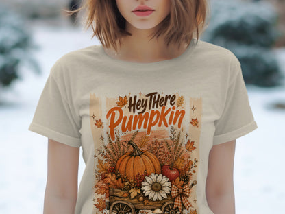 Hey There Pumpkin graphic on a tan t-shirt with fall harvest illustration.