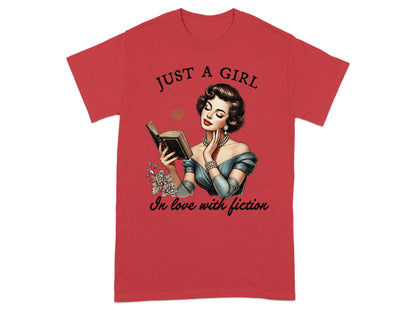 Red t-shirt with "Just a girl in love with fiction" text and vintage woman reading.
