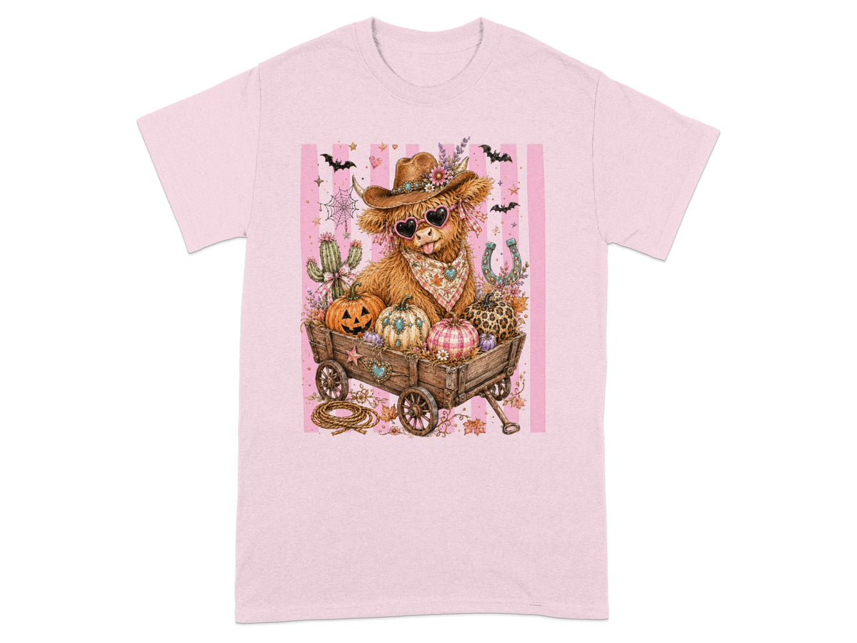 Cow dressed as cowboy in wagon with pumpkins, cactus, and bats.