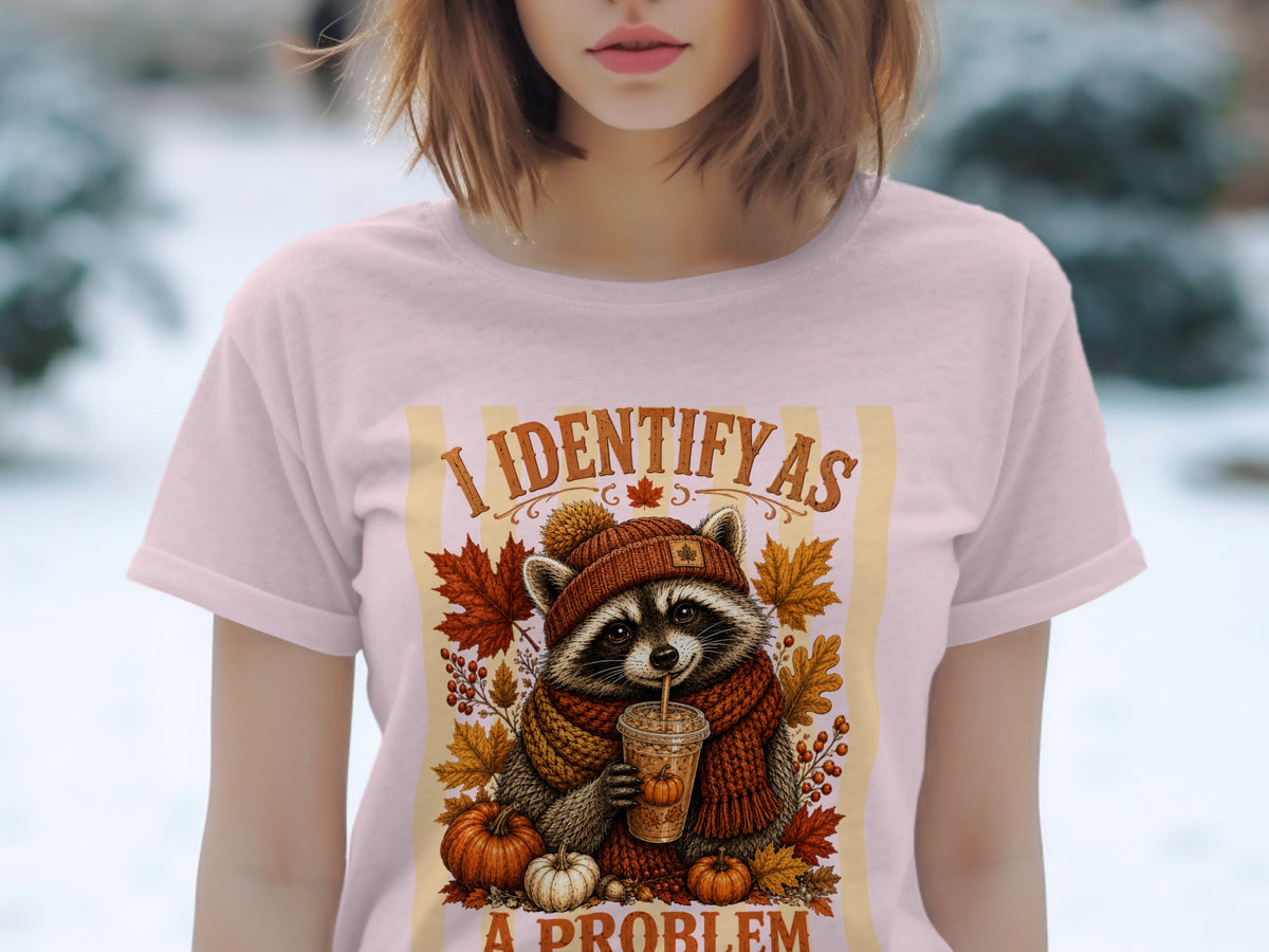 Raccoon in a hat and scarf drinks from a cup with text "I IDENTIFY AS A PROBLEM."