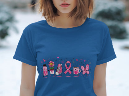 Blue t-shirt with cartoon pink breast cancer awareness ribbon, water bottle, flower, shoe, and butterfly.