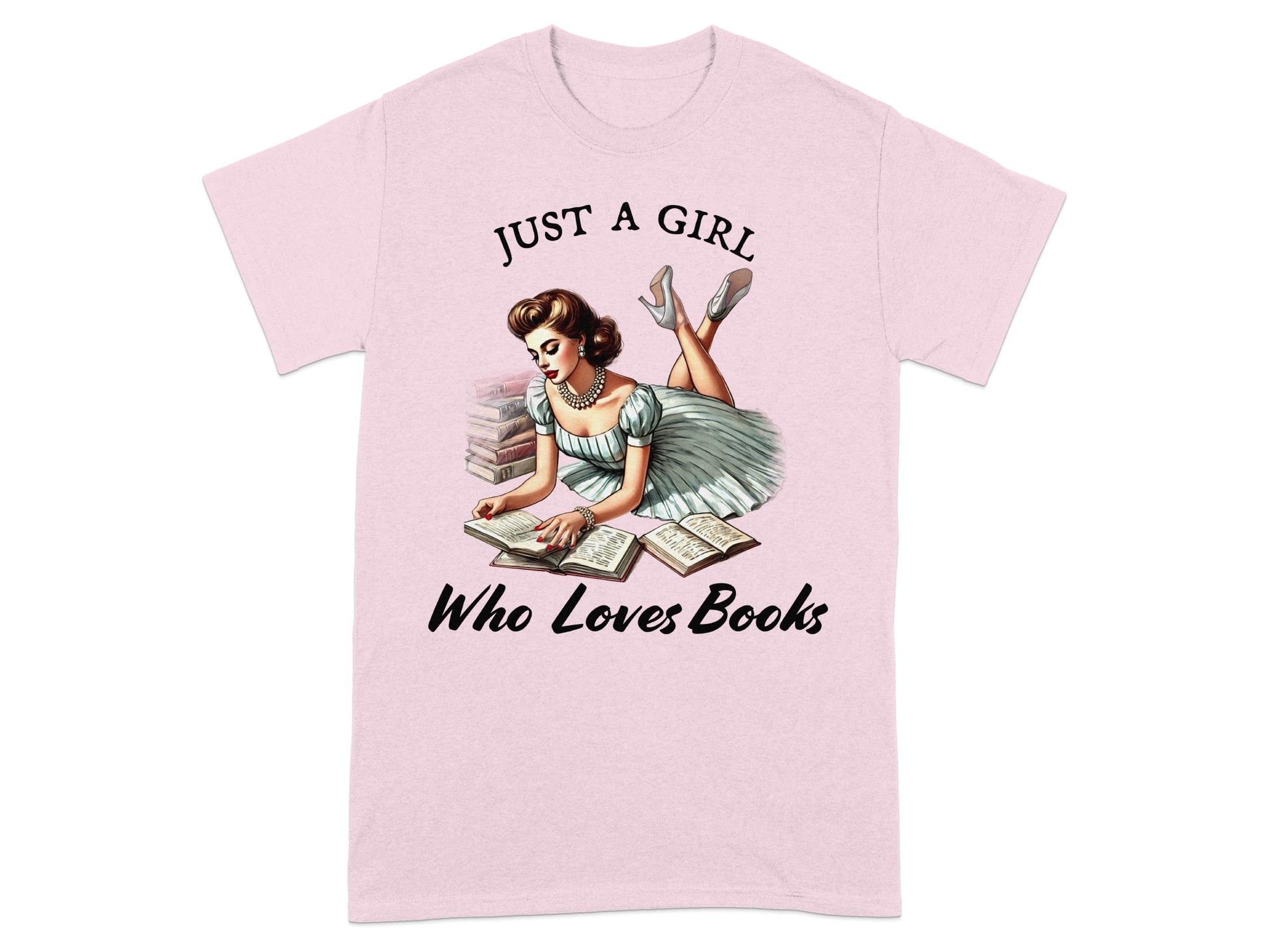 Pink t-shirt with illustration of a woman reading books, text says "Just a girl who loves books".
