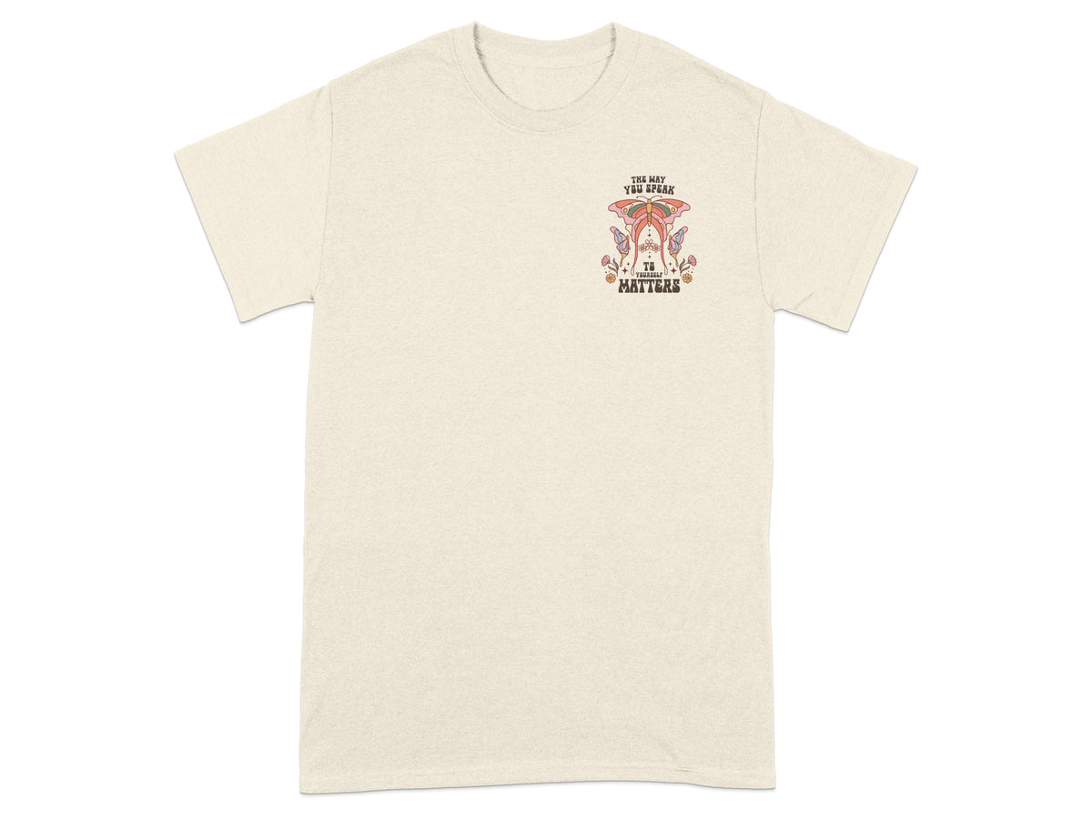 Light cream t-shirt with graphic text "The Way You Speak To Yourself Matters."