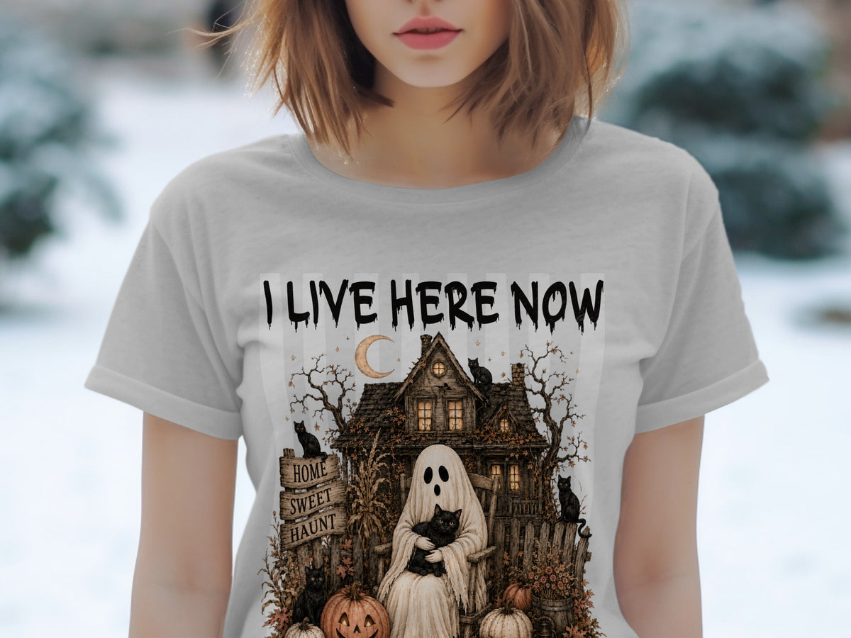 Ghost holding cat in rocking chair with spooky house and text "I LIVE HERE NOW".