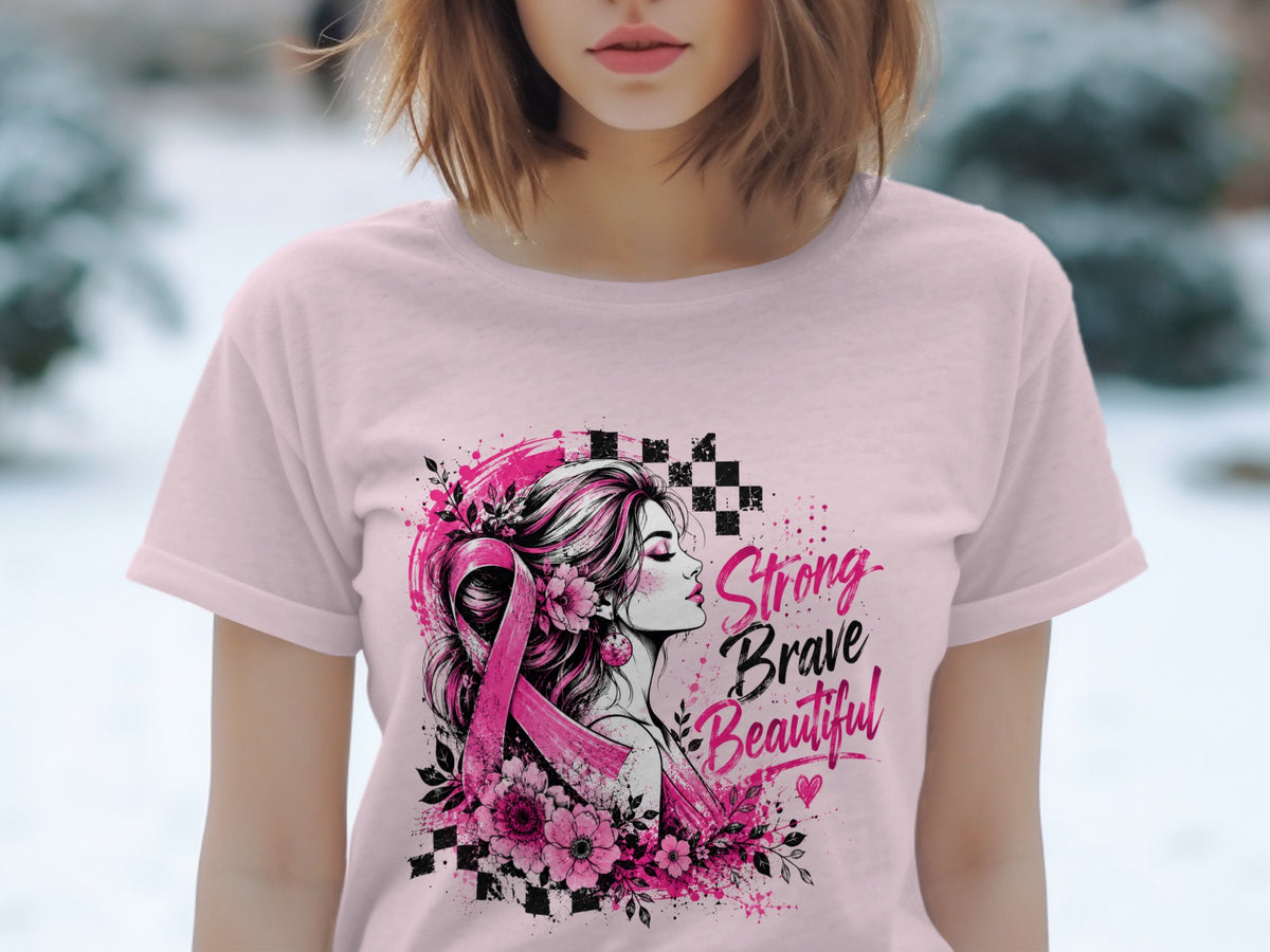 Pink t-shirt with a design of a woman, pink ribbon, flowers, and text "Strong Brave Beautiful."