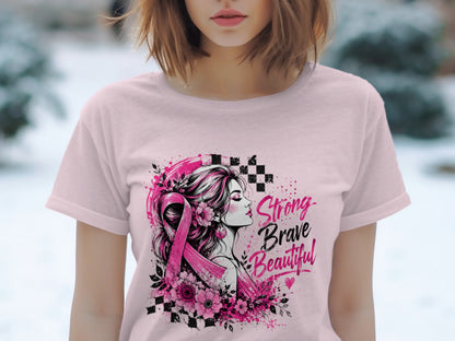 Pink t-shirt with a design of a woman, pink ribbon, flowers, and text "Strong Brave Beautiful."