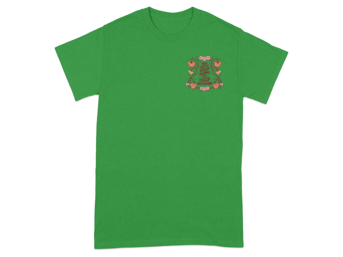 Green t-shirt with floral design and text "You gotta keep going to keep growing".