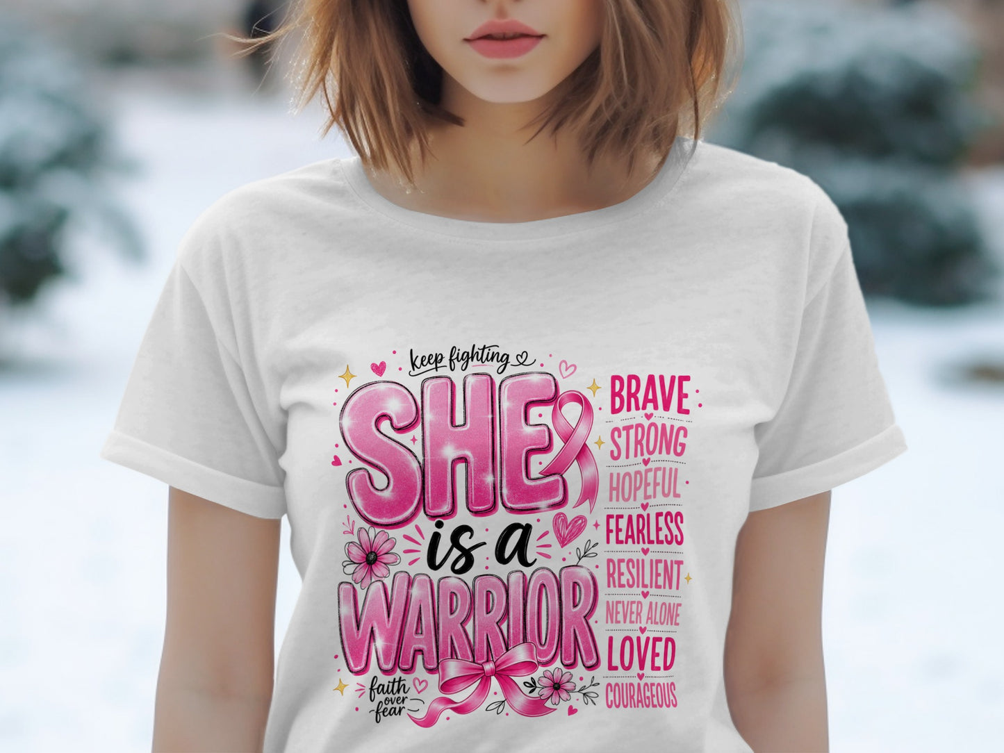 White t-shirt with "SHE is a WARRIOR" in pink, with supporting words and a pink ribbon.