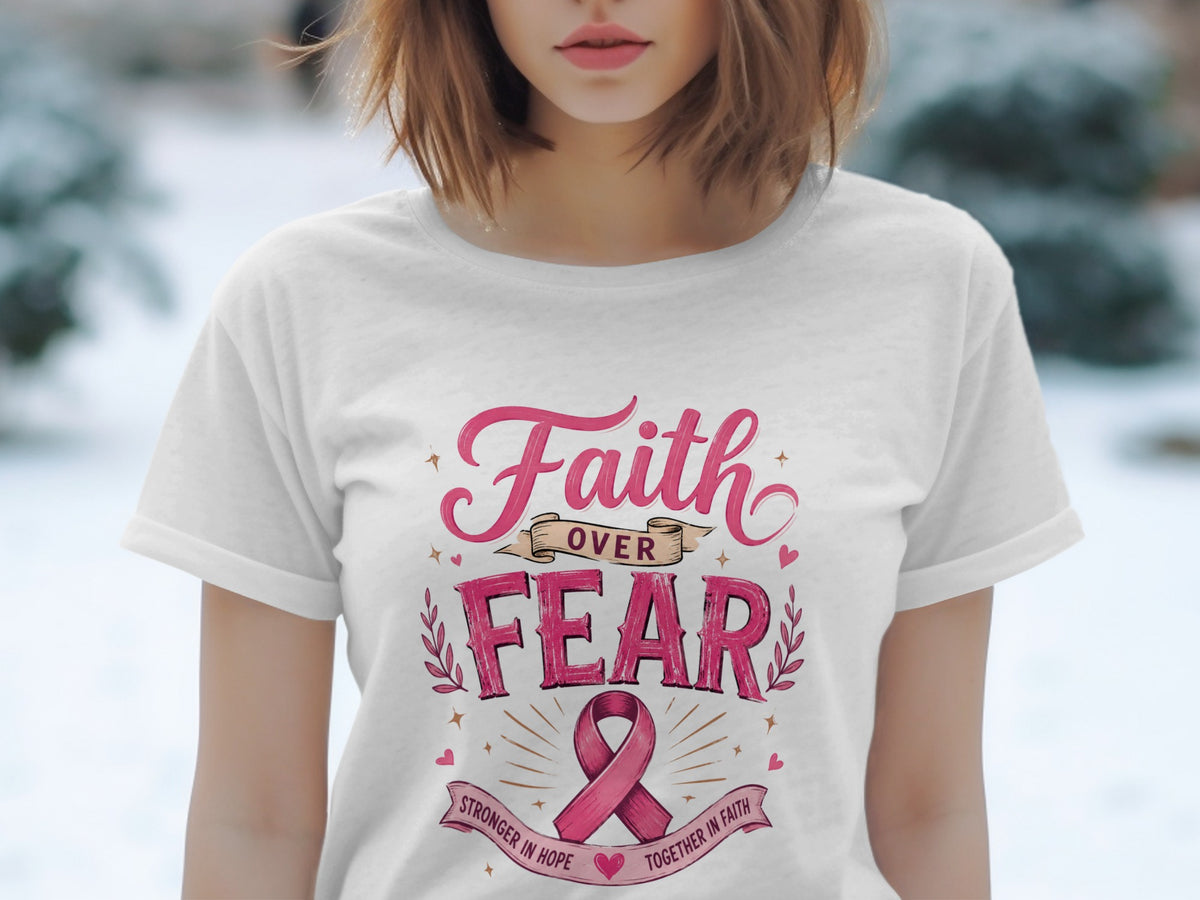 White t-shirt with "Faith Over Fear" and pink ribbon design.