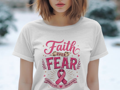 White t-shirt with "Faith Over Fear" and pink ribbon design.