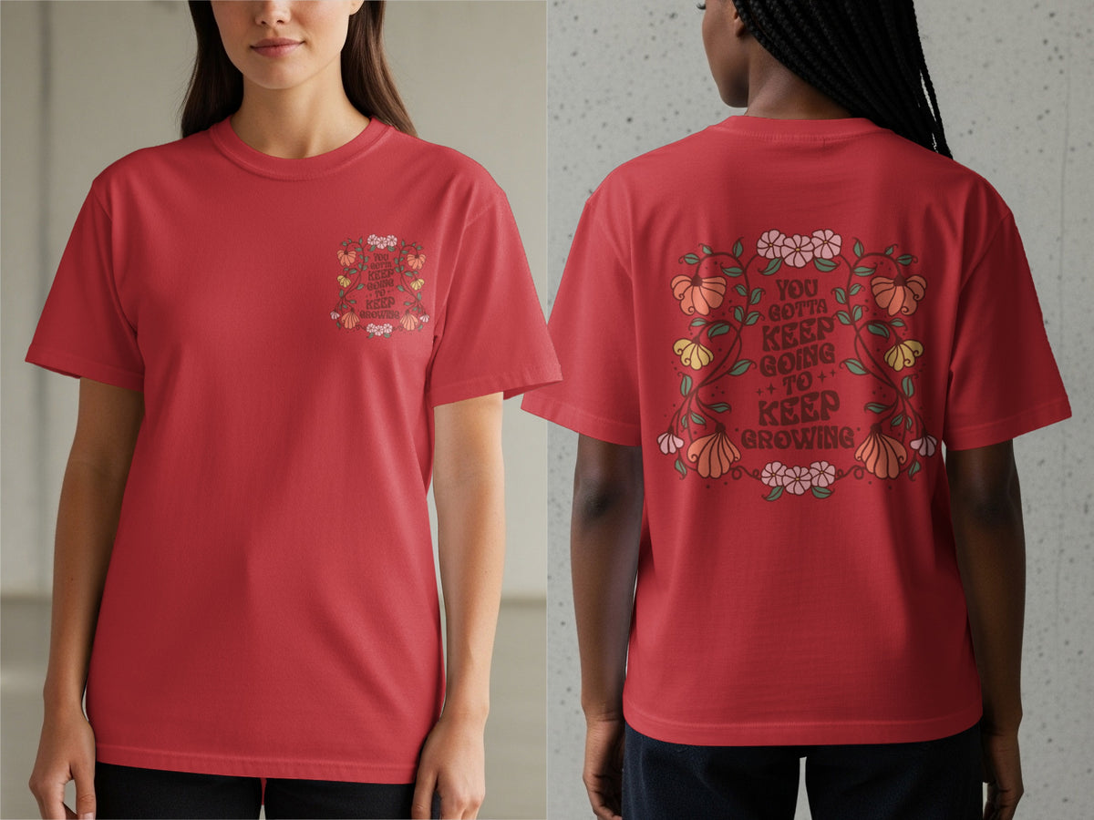 Red t-shirt with floral graphic and text "YOU GOTTA KEEP GOING TO KEEP GROWING".