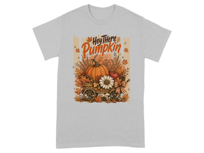 T-shirt with "Hey There Pumpkin" text and a wagon filled with pumpkins and fall leaves.