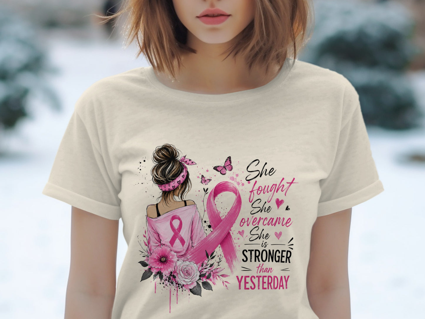Shirt design with pink ribbon, butterflies, flowers, and text: "She fought, She overcame, She is STRONGER than YESTERDAY."