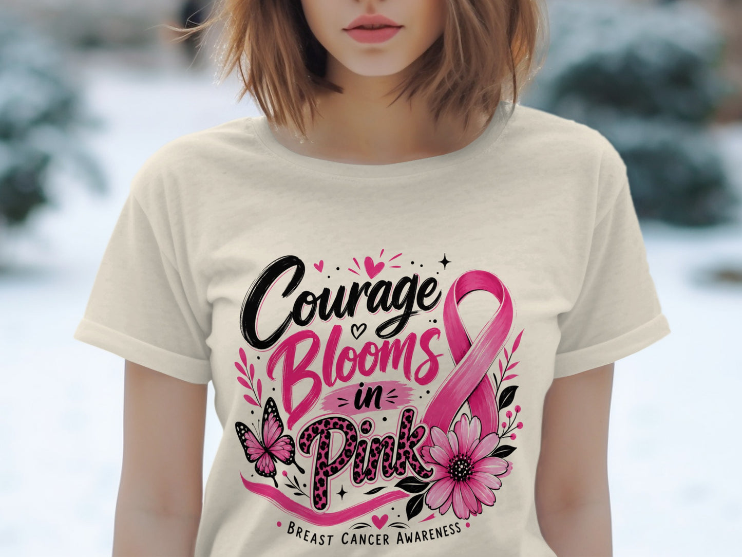 Cream t-shirt with "Courage Blooms in Pink" and breast cancer awareness ribbon.