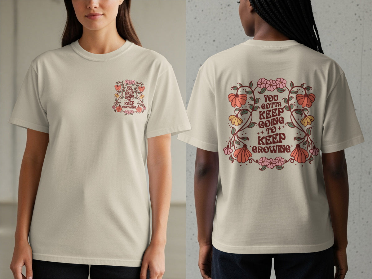 Light tan t-shirt with floral design and "You Gotta Keep Going To Keep Growing" text.