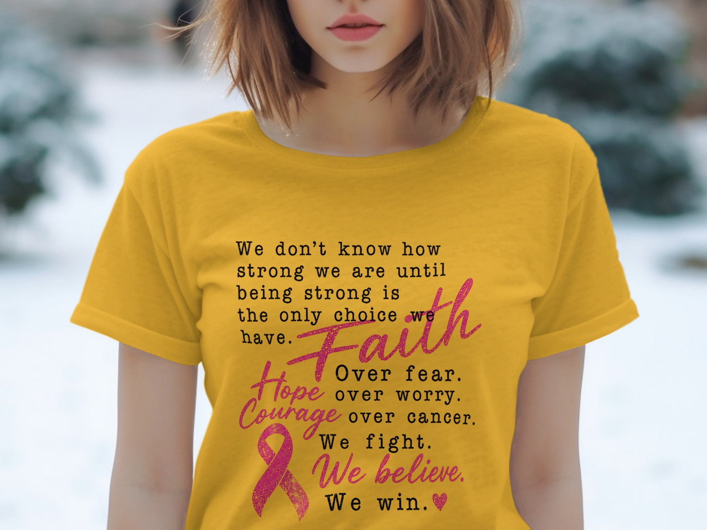 Yellow t-shirt with text about strength, faith, hope, courage, and winning over cancer.