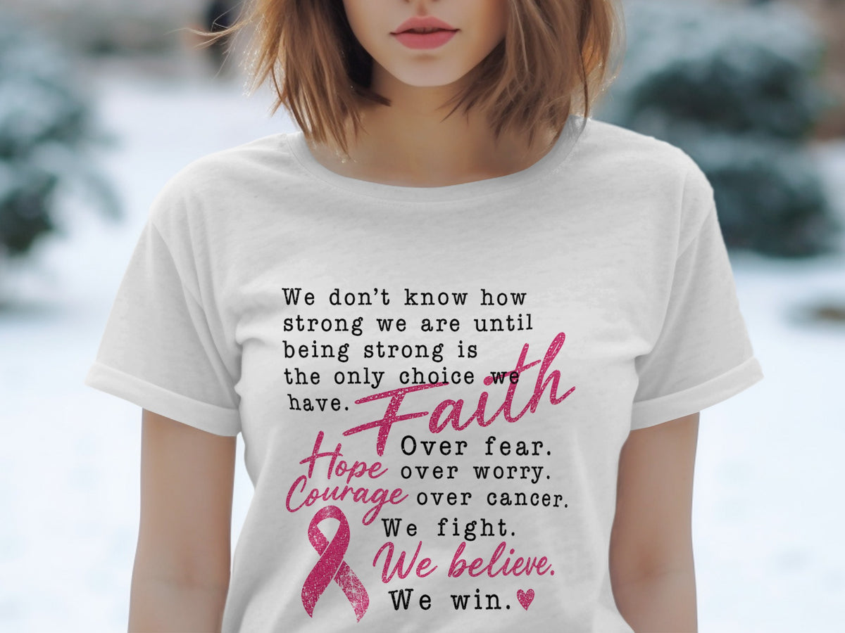 White t-shirt with text about strength, faith, hope, courage, and winning against cancer.