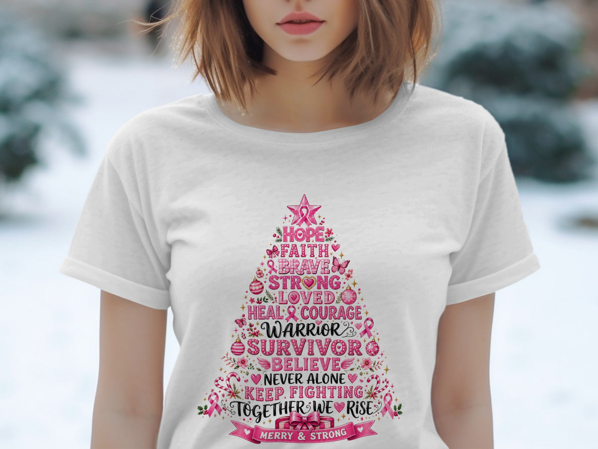 White t-shirt with a pink Christmas tree design featuring breast cancer awareness words.