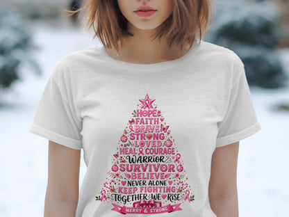 White t-shirt with a pink Christmas tree design featuring breast cancer awareness words.