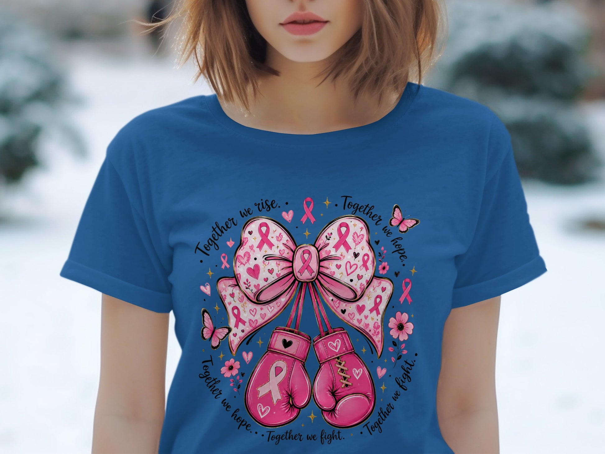 Blue t-shirt with pink boxing gloves, bow, and breast cancer ribbons.
