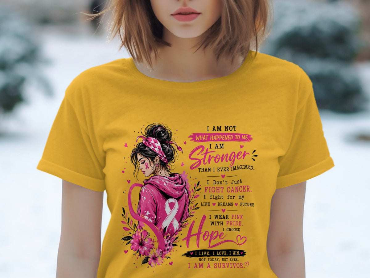 Yellow t-shirt with "I AM STRONGER" text and breast cancer awareness ribbon.
