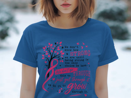 Blue t-shirt with tree, pink ribbon, and inspirational text about strength and growth.