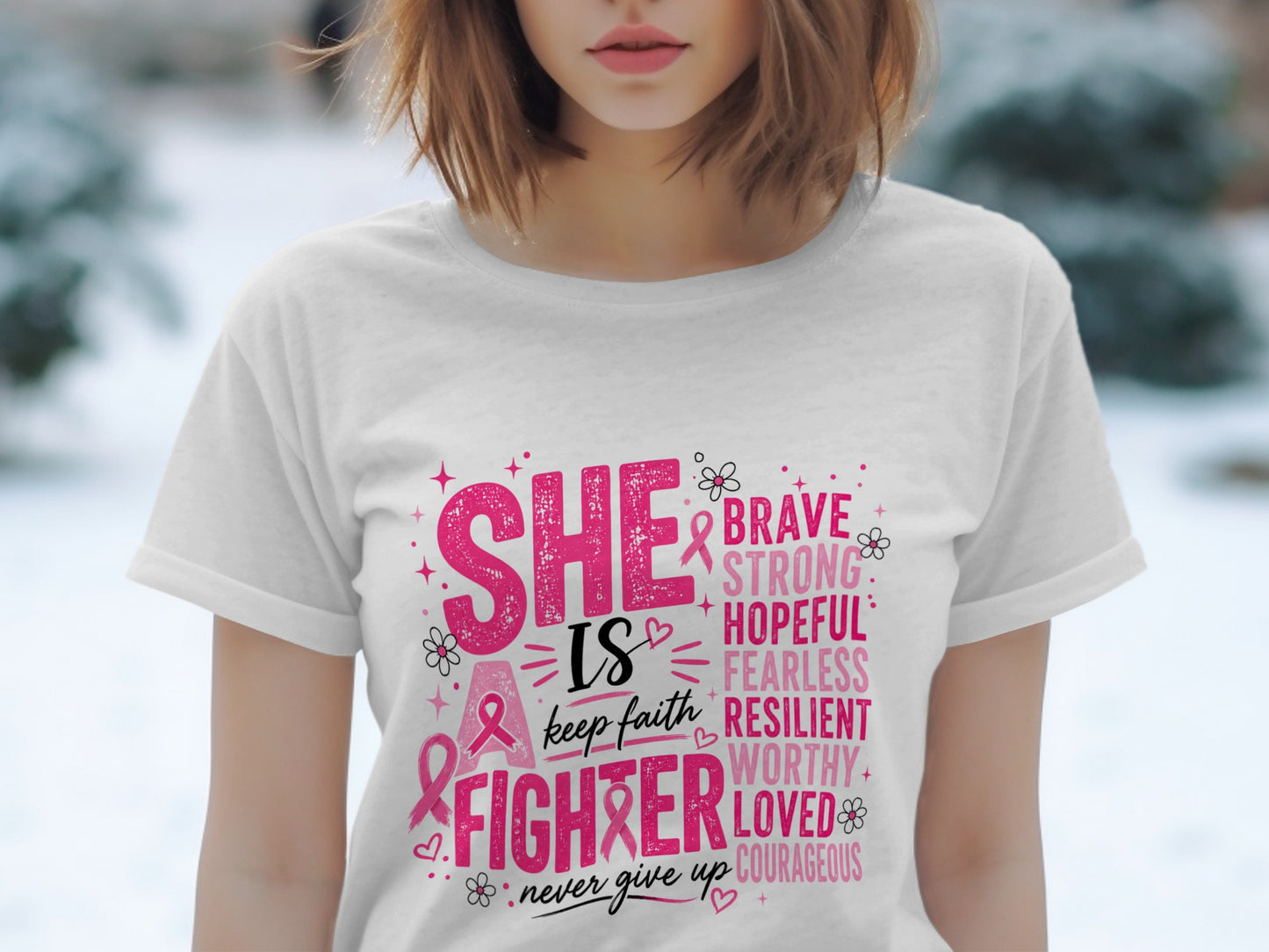 White t-shirt with pink text "SHE IS A FIGHTER" and empowering words.