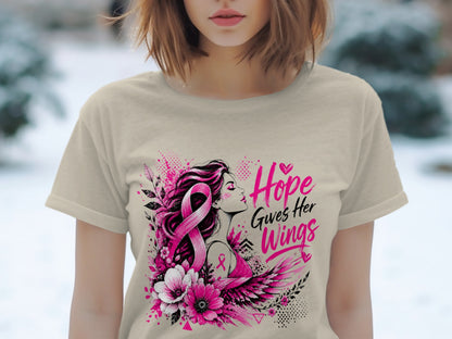 T-shirt with pink breast cancer ribbon, woman, flowers, and text "Hope Gives Her Wings".