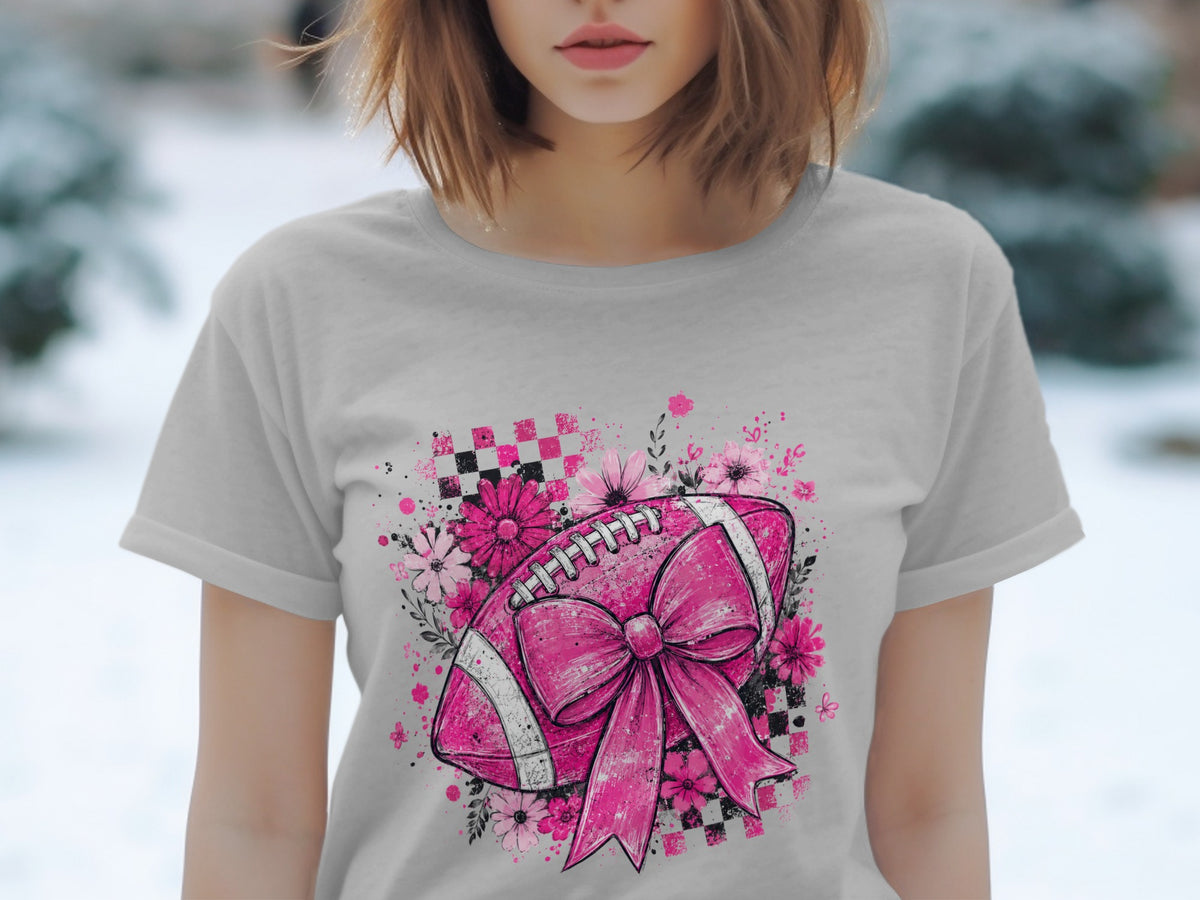 Pink football with bow and flowers on a checkered background.