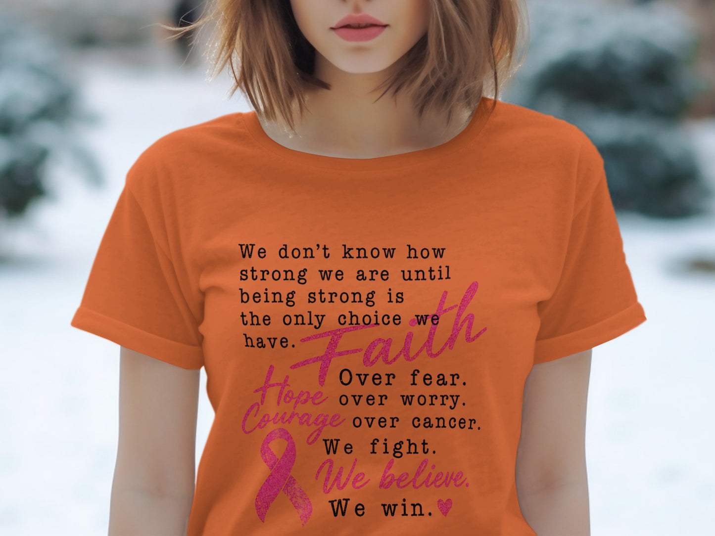Orange t-shirt with text "Faith over fear, hope over worry, courage over cancer. We fight. We believe. We win."