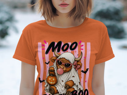 Orange t-shirt with cow dressed as ghost, holding pumpkin lantern, and text "Moo".