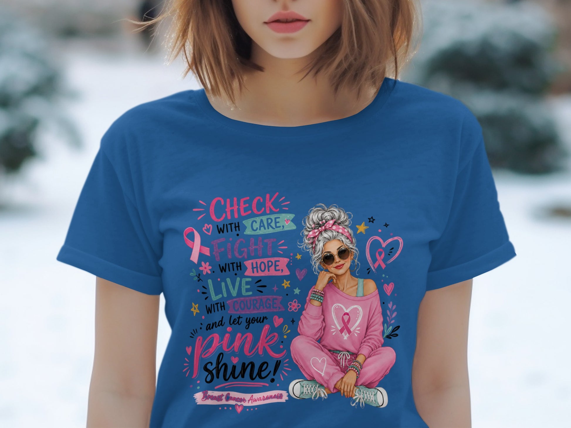 Blue t-shirt with "Check with care, fight with hope, live with courage, and let your pink shine!" text and pink ribbon graphic.