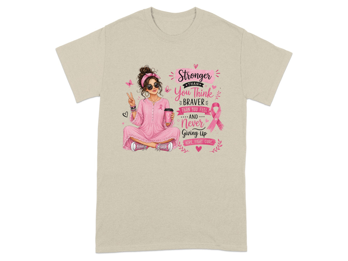 T-shirt with woman holding coffee, breast cancer ribbon, and text "Stronger Than You Think, Braver Than You Feel, Never Giving Up".
