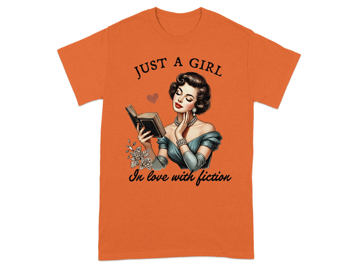 Orange t-shirt with "Just a Girl in Love with Fiction" and vintage drawing of a woman reading.