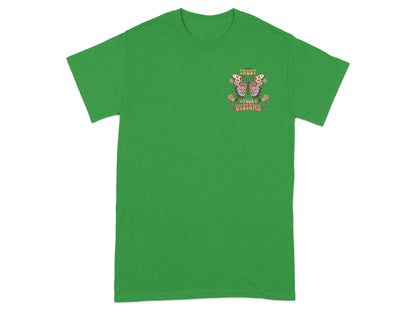 Green t-shirt with a butterfly graphic and text "TRUST YOUR VISIONS".