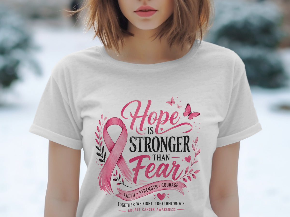 White t-shirt with pink ribbon and text "Hope is Stronger Than Fear".