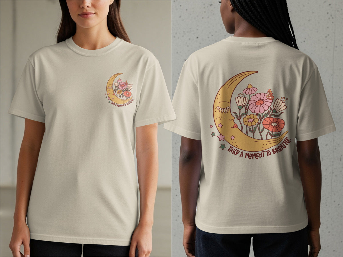 Cream t-shirt with back graphic of a moon with flowers and text "Take a Moment to Breathe."