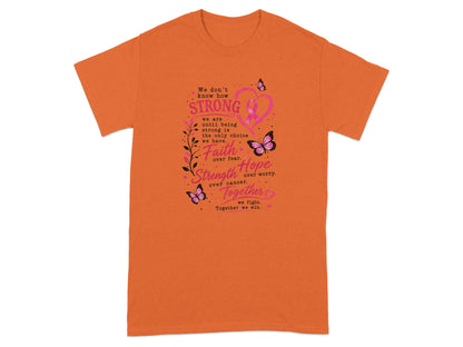 Orange t-shirt with pink ribbon, butterflies, and empowering text about strength, faith, and hope.