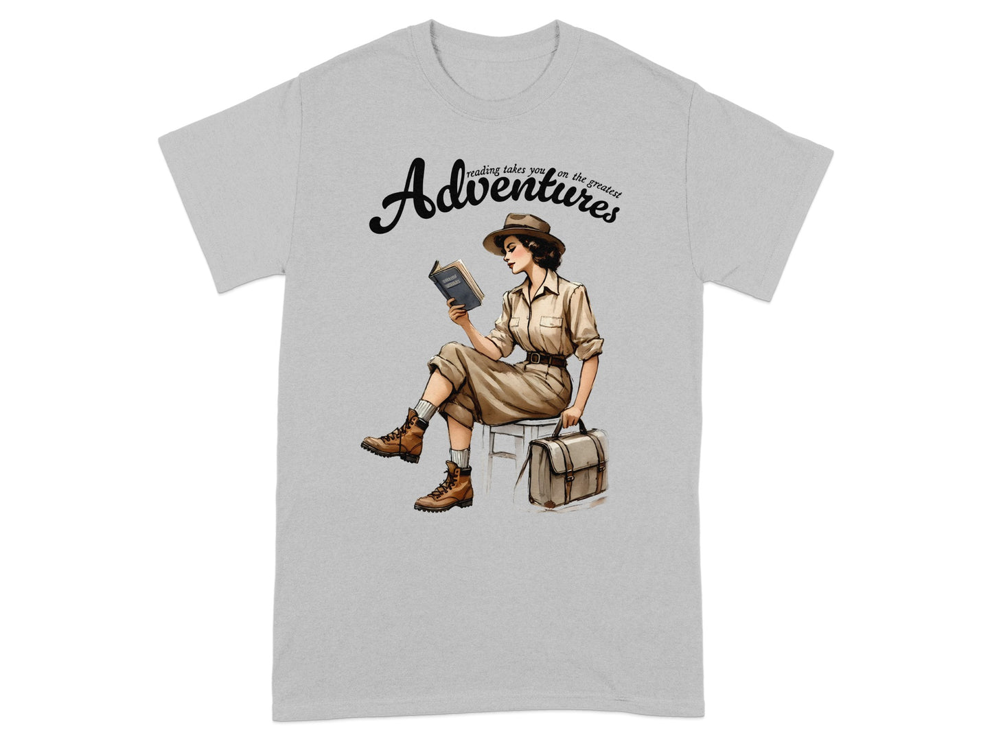 T-shirt with "Adventures" graphic of woman reading in safari attire.