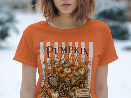 Orange t-shirt with "Pumpkin Patch" graphic featuring a wagon of pumpkins.